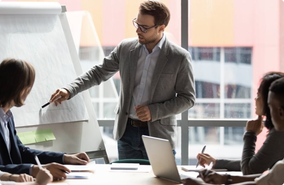 Man pointing to whiteboard