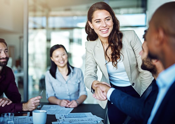 Smiling woman shaking hands