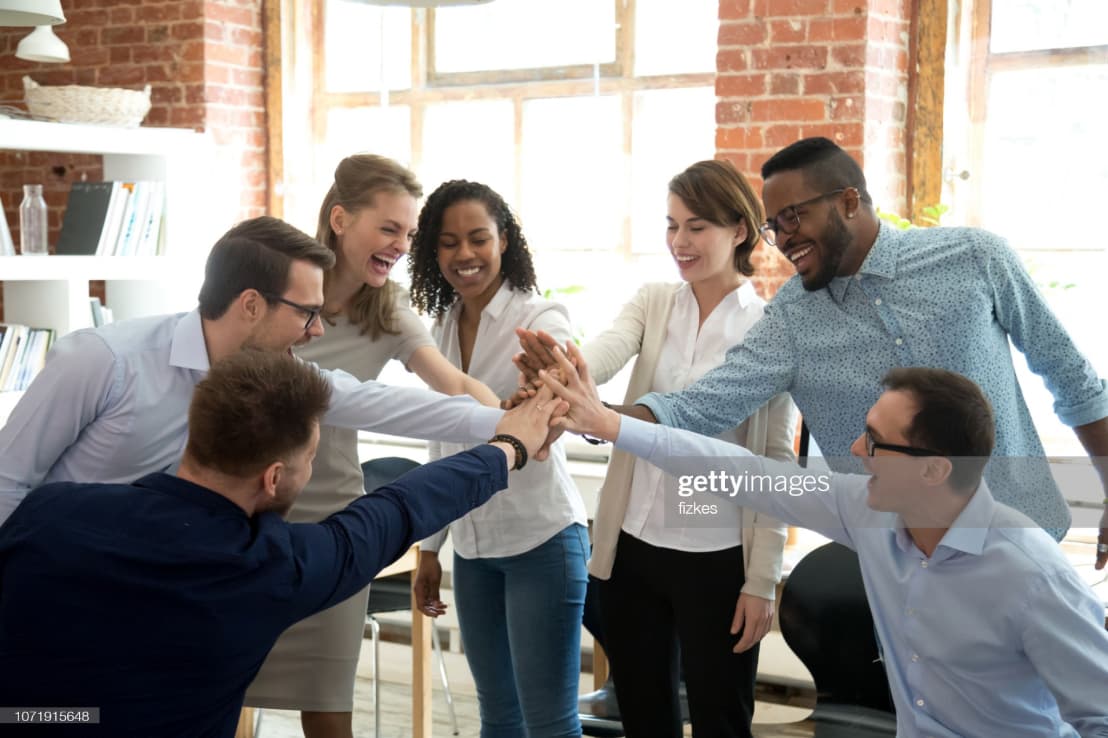 Group of people high-fiving